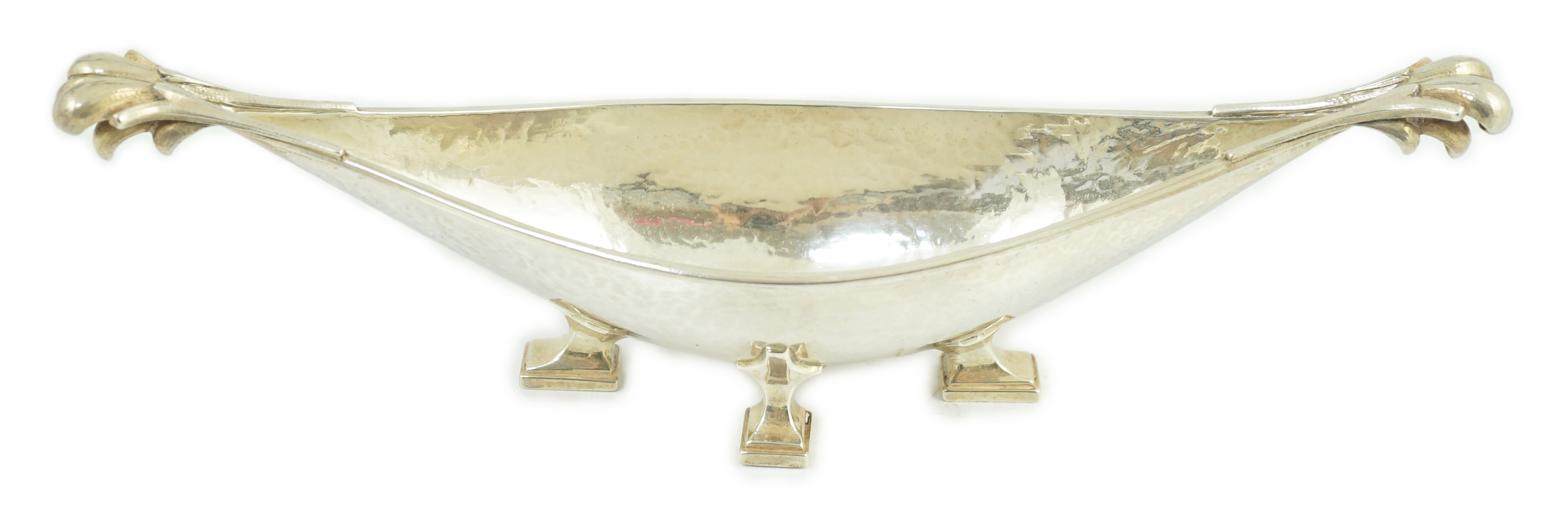 A George V Arts & Crafts planished silver boat shaped dish, by Omar Ramsden